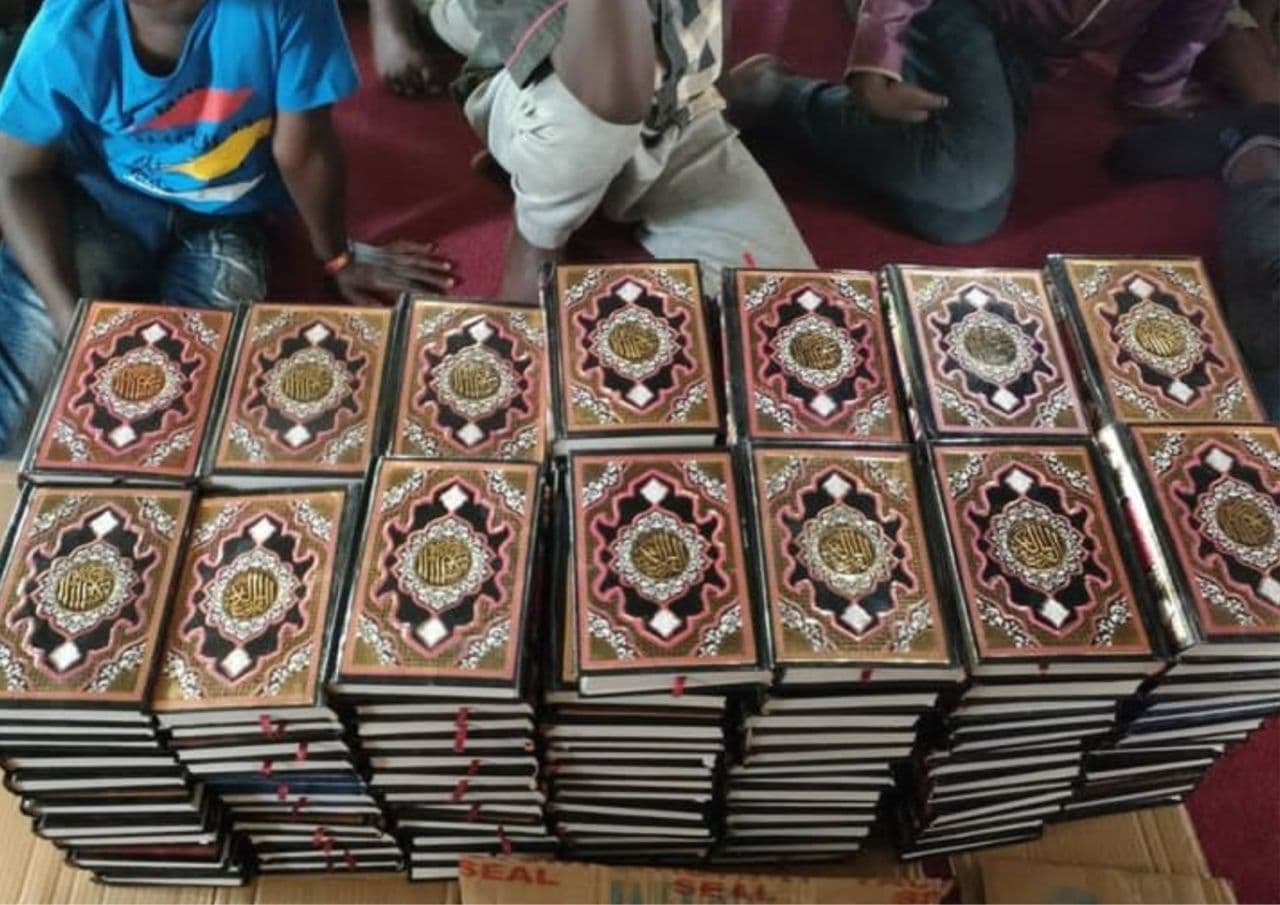 Qur'ans being provided to Muslim communities.